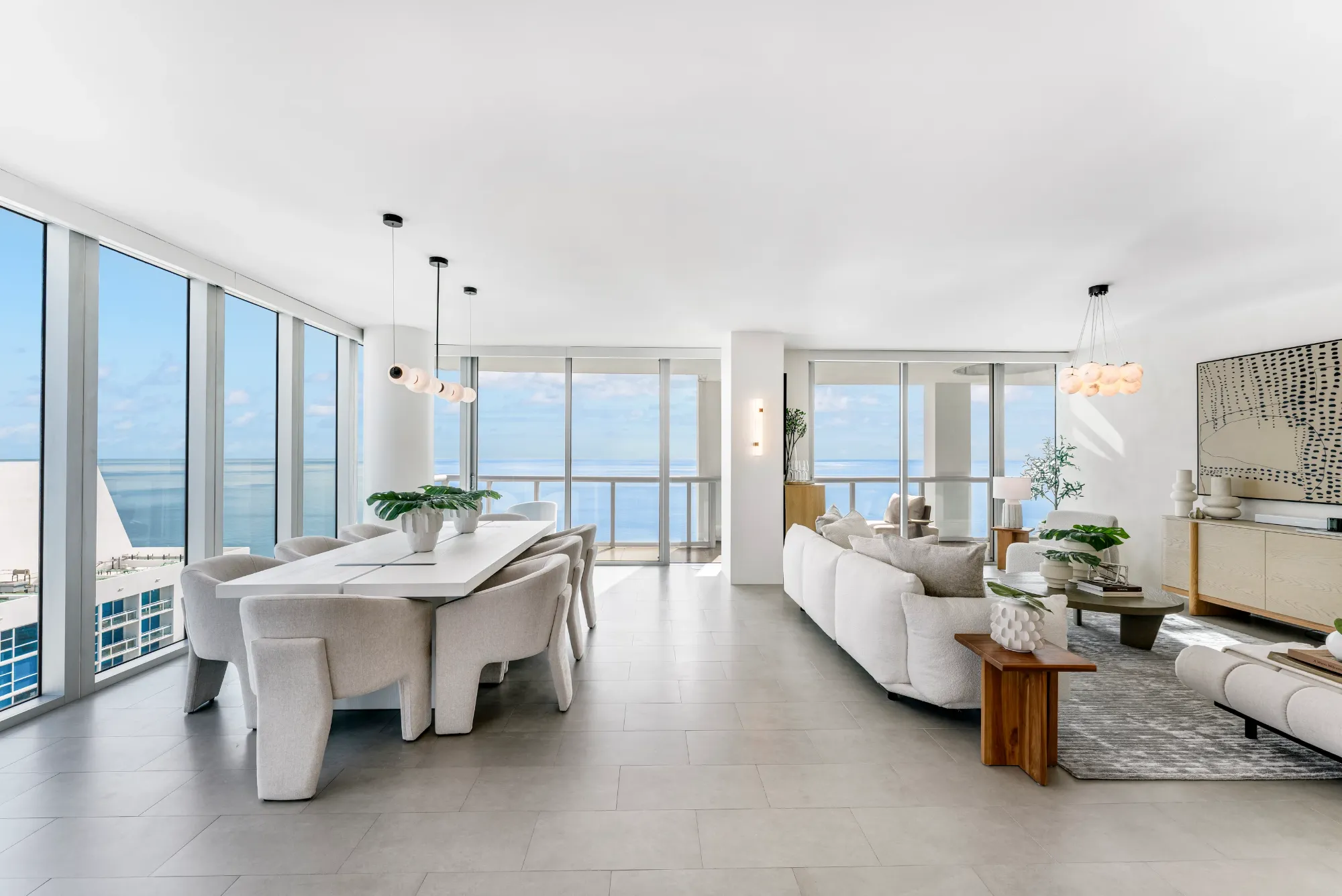 Great room with dining and living areas open to the terrace