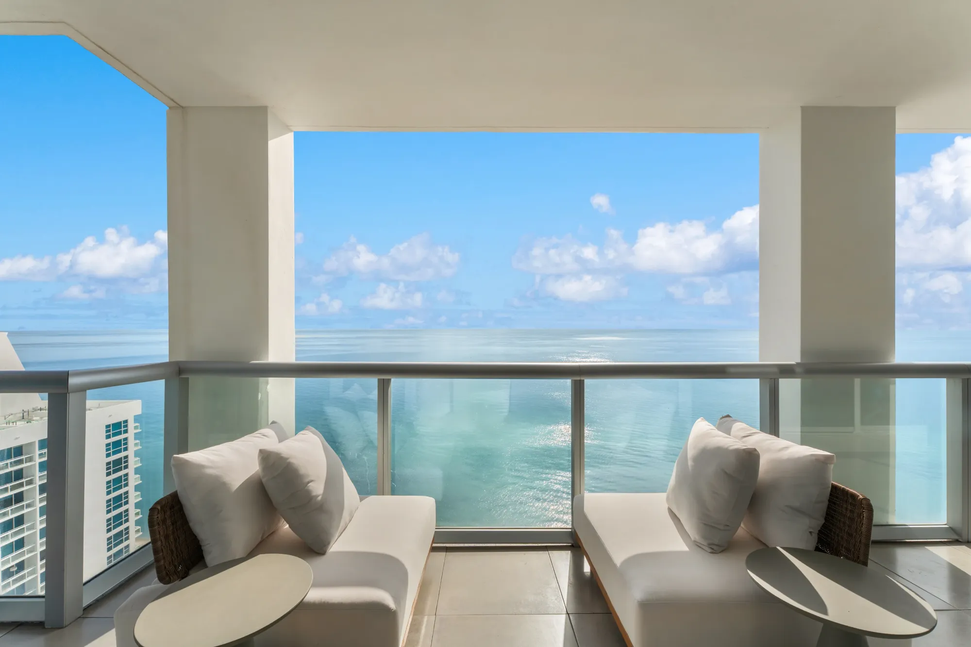Terrace lounge chairs facing the sea