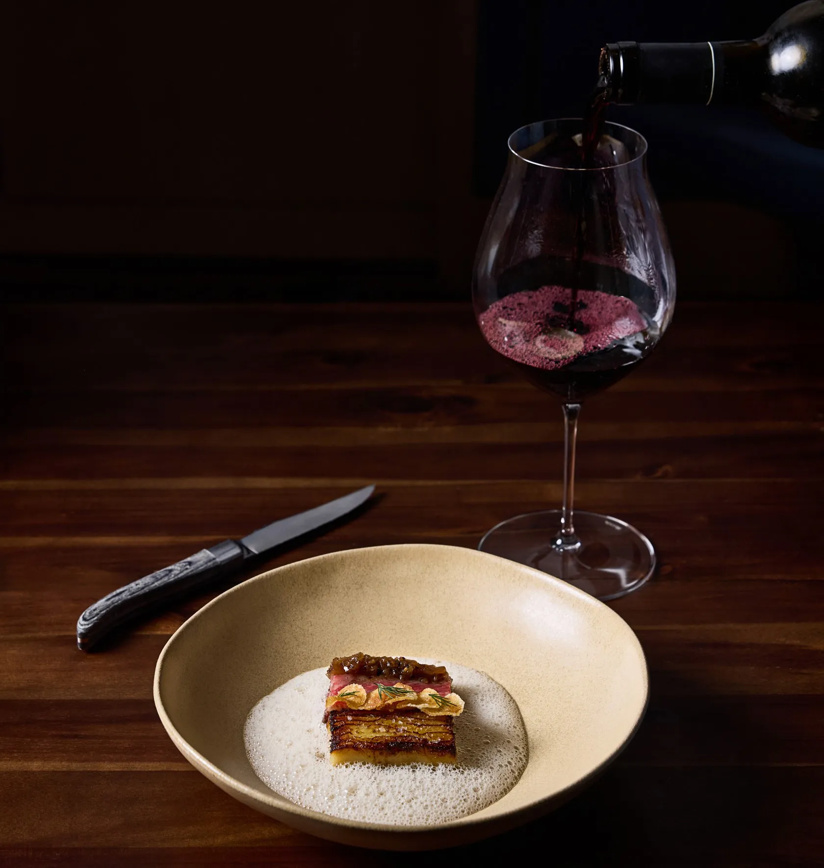 A course from the tasting menu, served with red wine